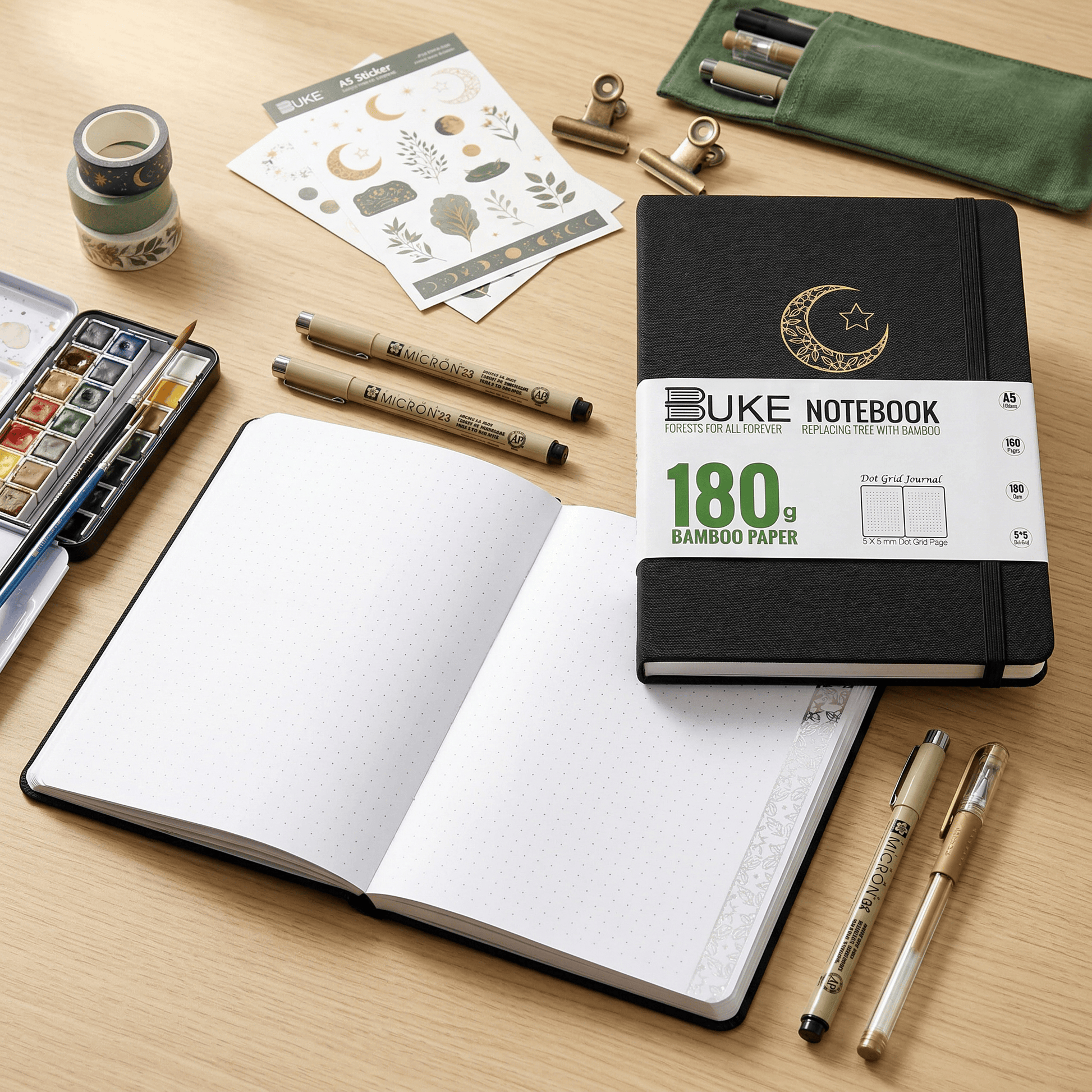 Open notebook showing 180gsm white dot grid pages