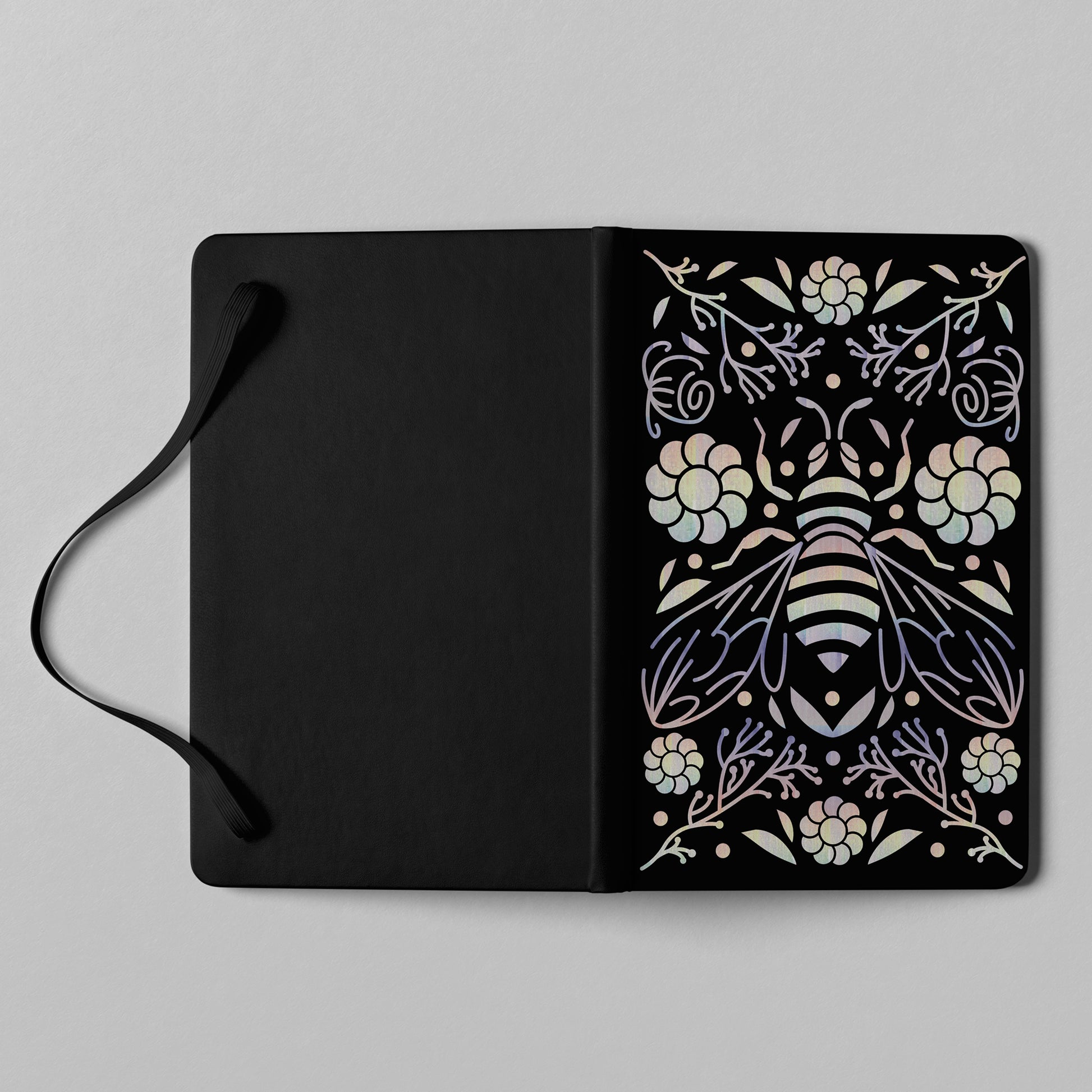 Black bee floral holographic notebook with elastic closure