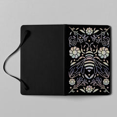 Black bee floral holographic notebook with elastic closure