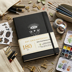 BUKE black A5 dot grid notebook with mystical eye and hands cover design