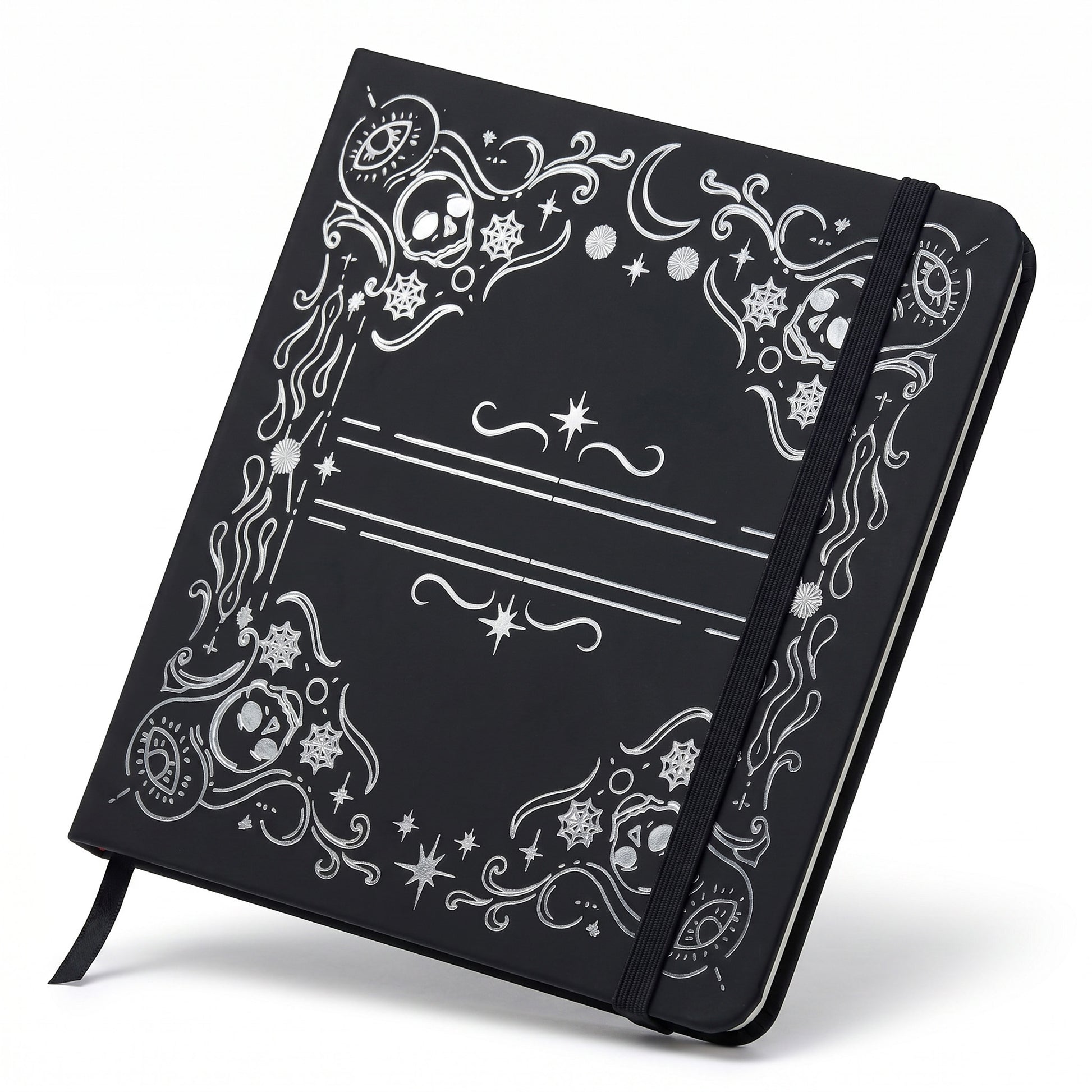 Detail of skull, moon, and spiderweb frame on black square notebook