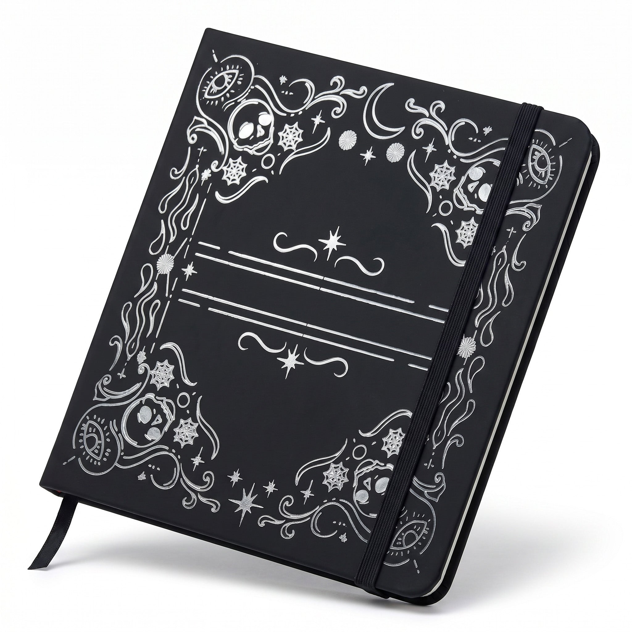 Detail of skull, moon, and spiderweb frame on black square notebook