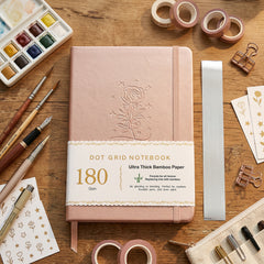 BUKE blush pink A5 dot grid notebook with embossed rose cover design