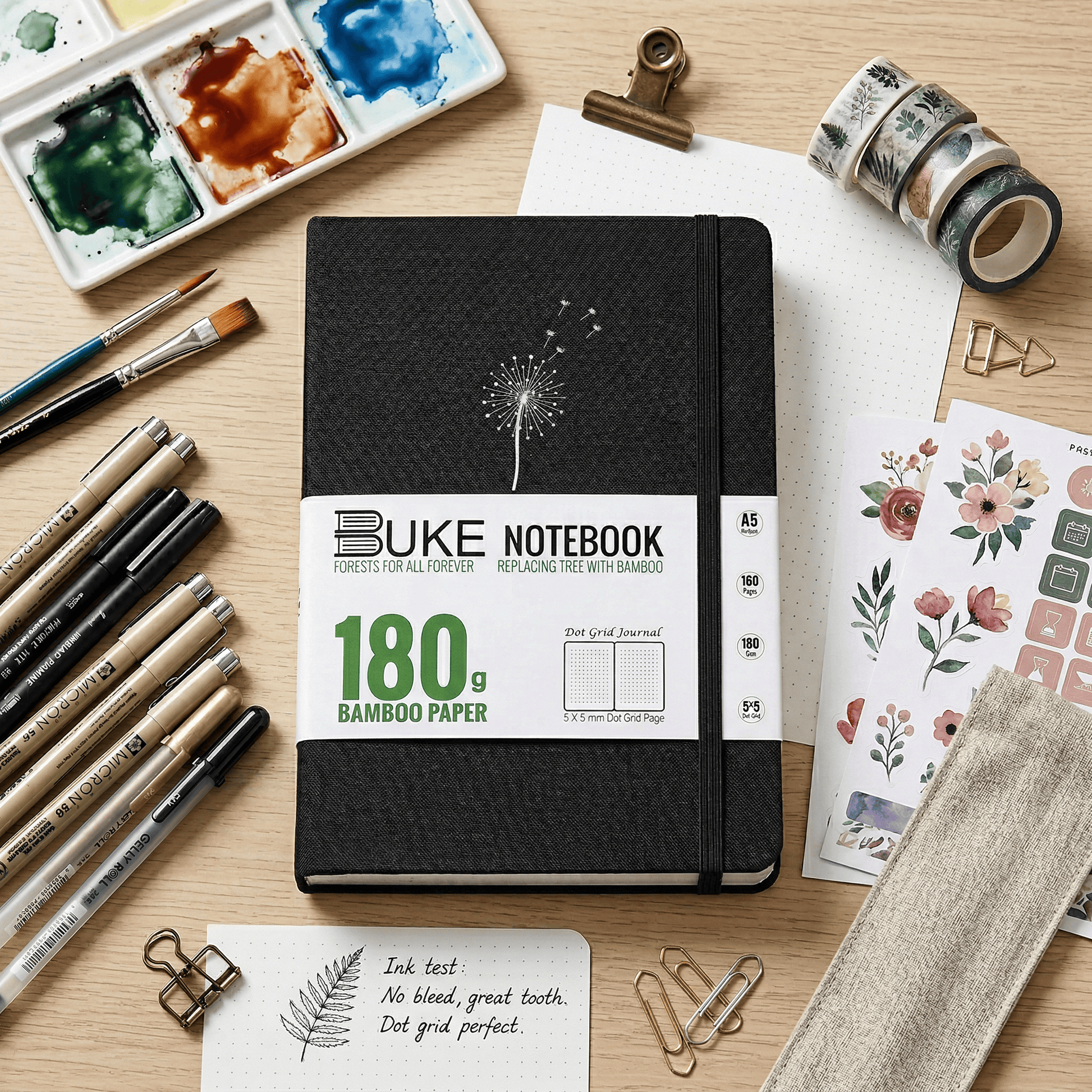 BUKE A5 notebook with black fabric cover and white dandelion logo