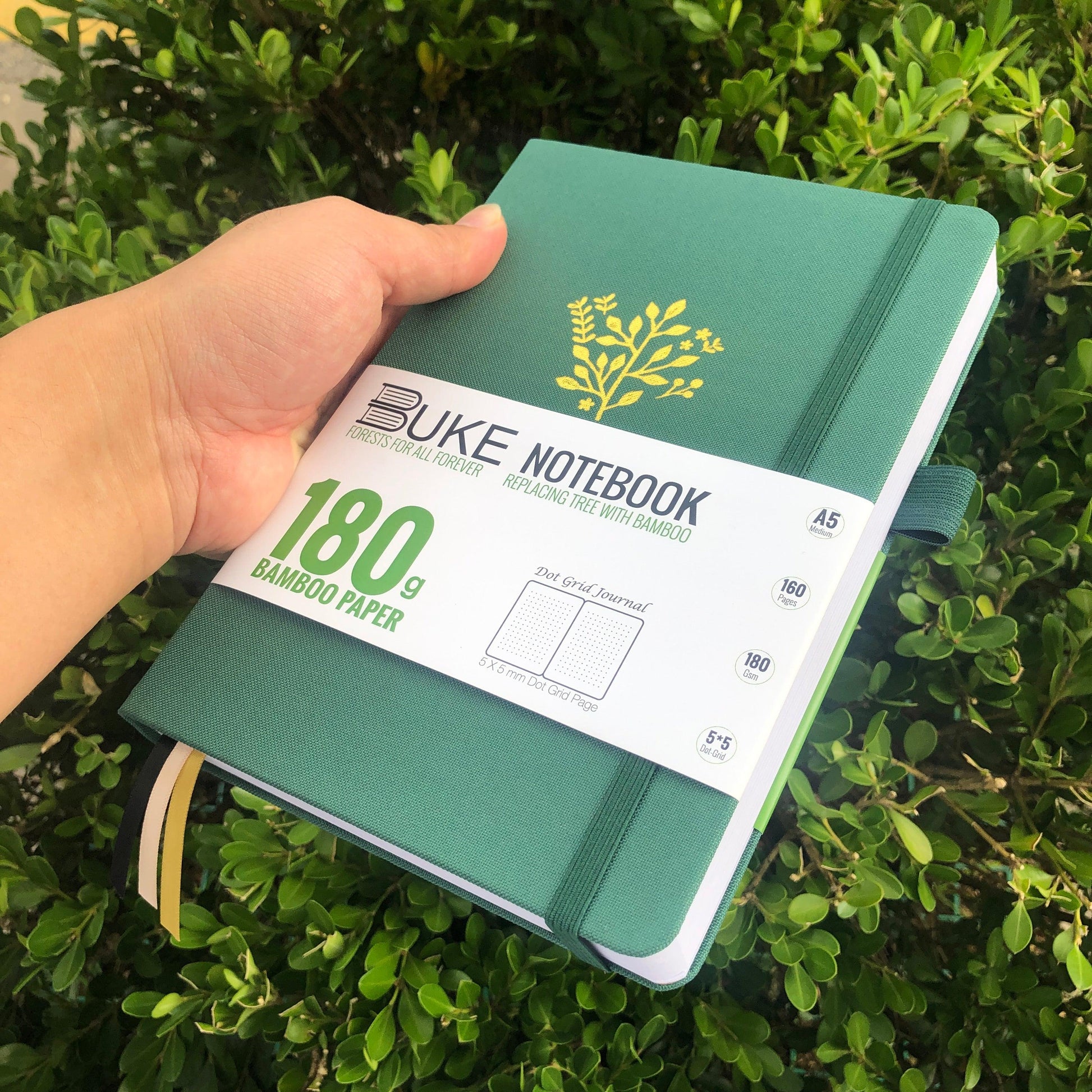 Premium green fabric notebook with botanical cover artwork